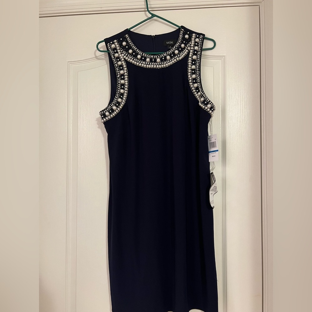 Pearl Neckline Beautiful Black Dress. Perfect for the Holiday Parties.